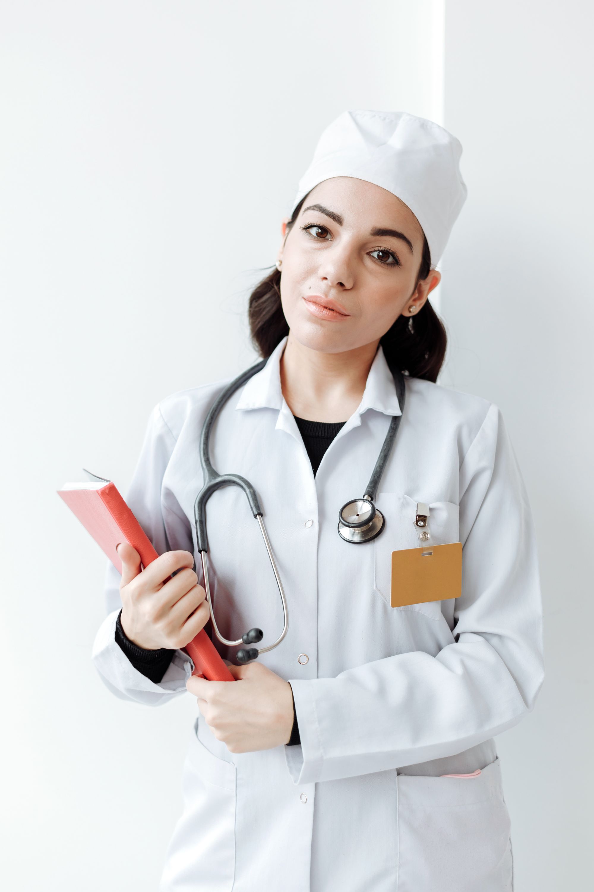 Female clinician in a white coat, representative of Clinova’s patient-facing clinical setting in Dubai.
